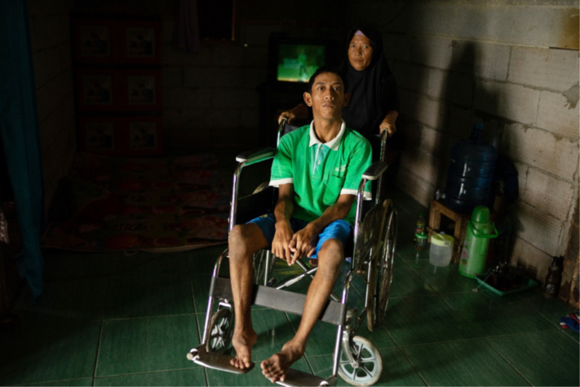 Ningsih with her son Yuliarto who is known as Yuli, a person with intelectual and physical disabilities.